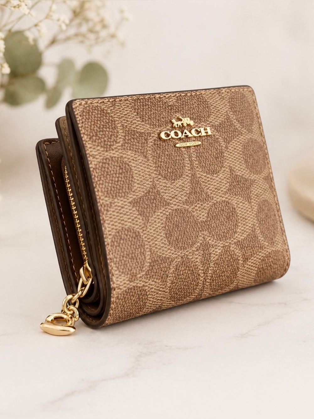 COACH Snap Wallet
In Signature Canvas